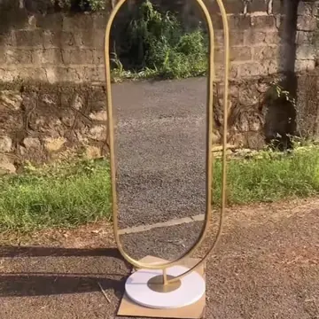 Oval gold mirror stand