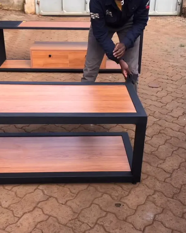 Fundi fitting a TV stand top