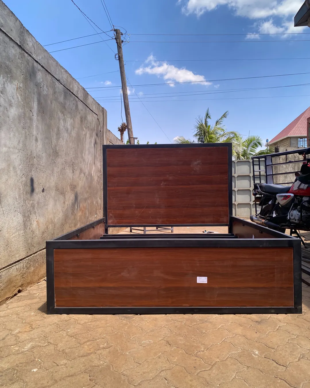 Welded metal bed frame with walnut finish